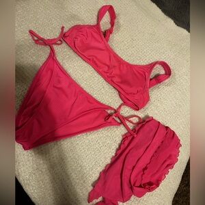 Pink bikini set with matching skirt cover up